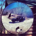 jeep in broken mirror.webp jeep in broken mirror.webp