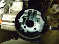 53 Remove lock plate bolts and support assembly.webp